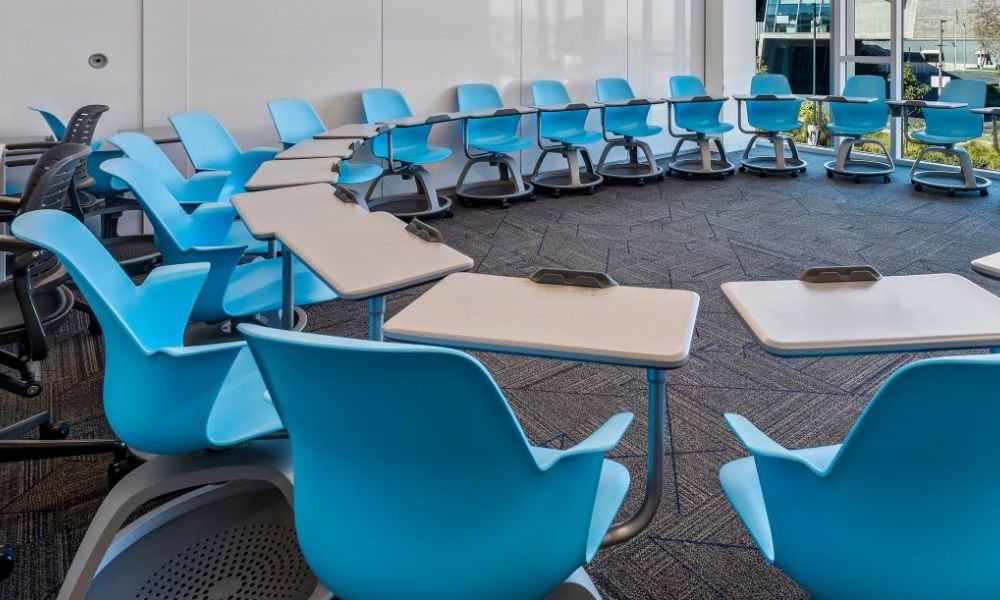 empty Pacifica classroom with desks in a circle