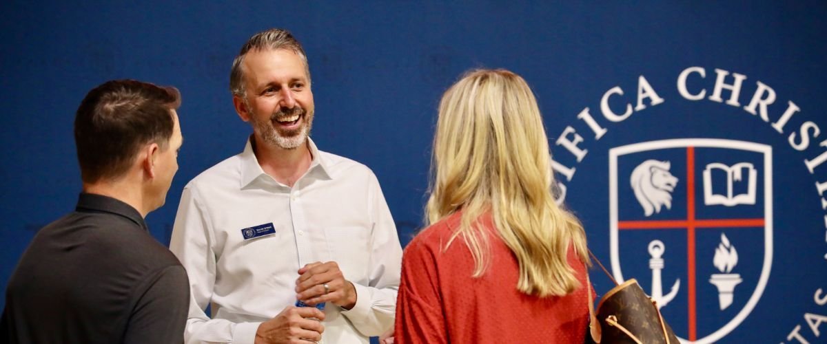 parents talking to Head of School David O'Neil
