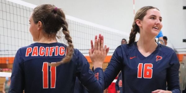 two Pacifica girls indoor volleyball players