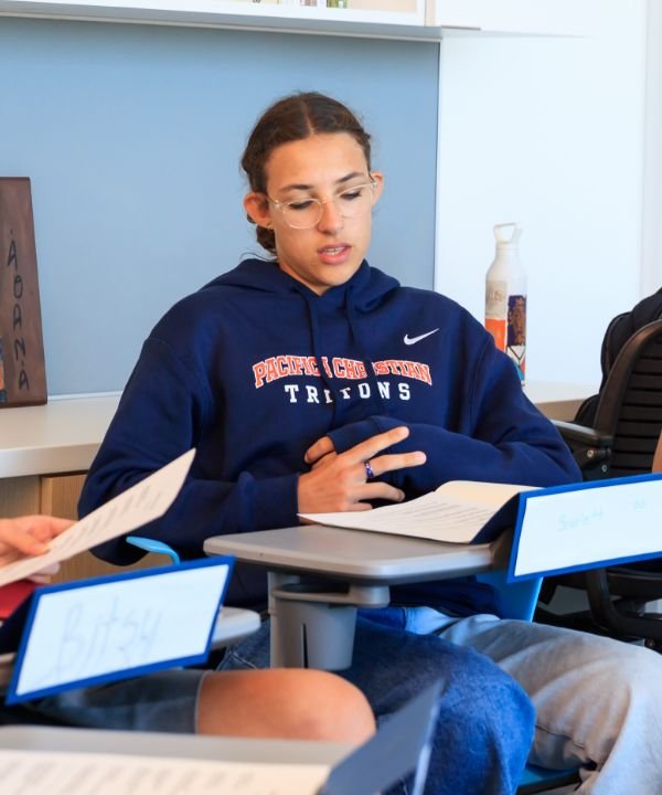 student participating in classroom group discussion