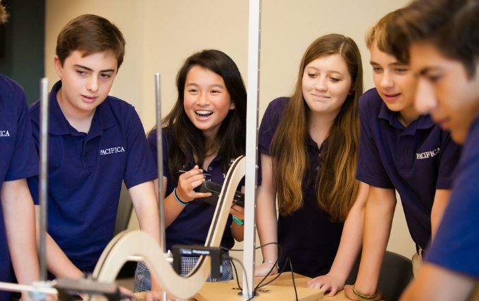 two Pacifica students sitting in classroom