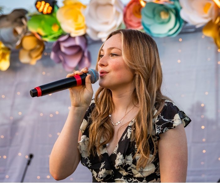 Pacifica student singing on stage