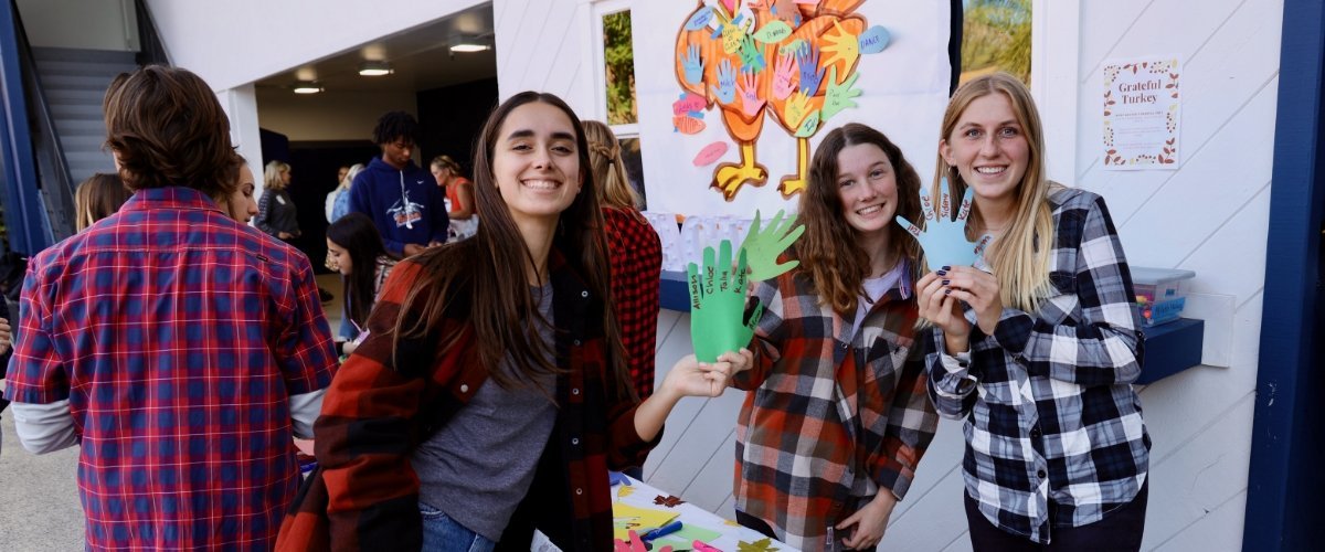 Pacifica students showing off hand art