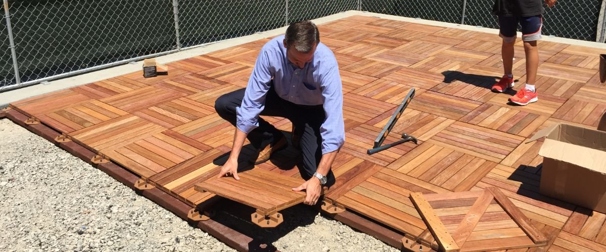 Pacifica Head of School helping with patio building